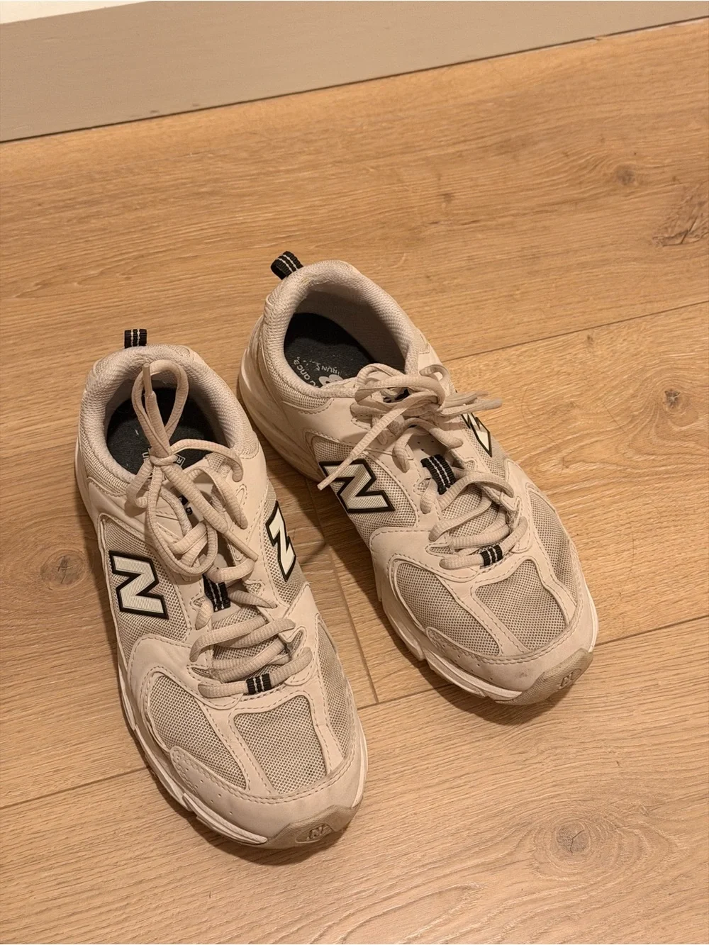 New Balance Cream Sneakers with Black Logo